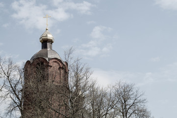 Beautiful old church tower with the cross background