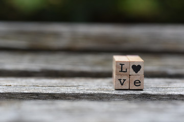 Love written in alphabet letters with a heart 