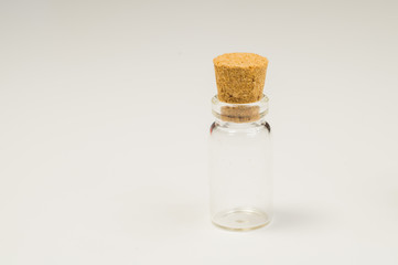 Empty little bottles with cork stopper on white background. transparent containers. test tubes
