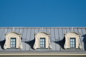 Roof with windows. attic of the house with the sky