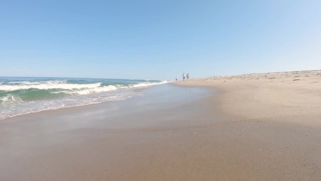 Waves hitting the beach on a popular beach during summer CAPE COD, Massachusetts, United States of America