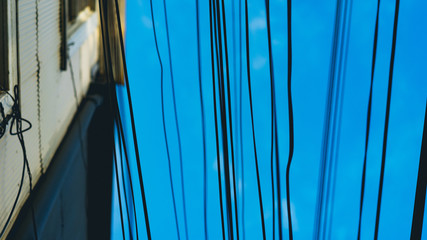 lots of power lines in the sky