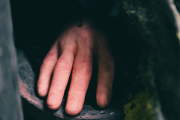 zombie hand halloween out of his grave at night