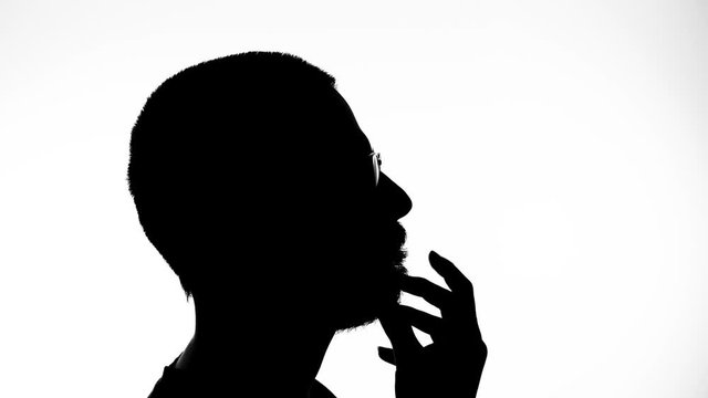 Silhouette of a man thinking