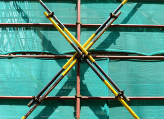 scaffolding and protection netting on an unfinished building