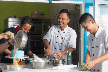 team of pastry chef inside kitchen