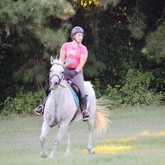 riding on white horse turning
