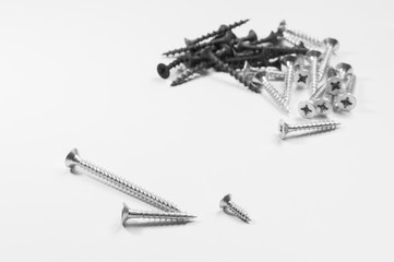 Pile of screws on a white background