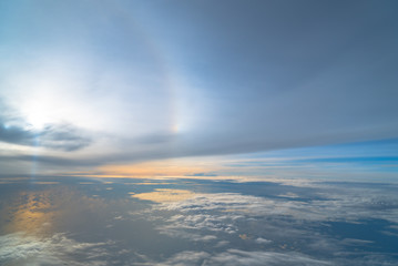 Halo in the sky is beautiful on the atmosphere above the clouds..The halo in the sky is beautiful on the atmosphere above the white clouds.
