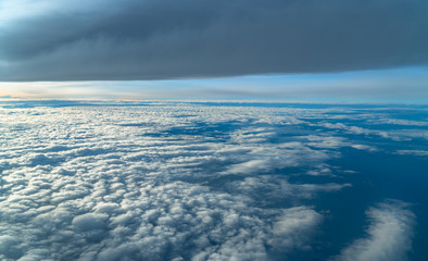 sunrise in the sky is beautiful on the atmosphere above the white clouds.