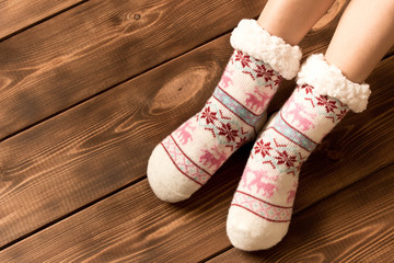Obraz na płótnie Canvas Funny warm socks on the little girl's feet