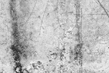 Fototapeta premium Texture of a concrete wall with cracks and scratches which can be used as a background