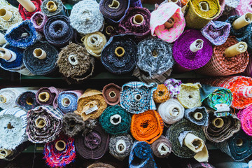 Various rolls of fabric at a bulk fabric stop