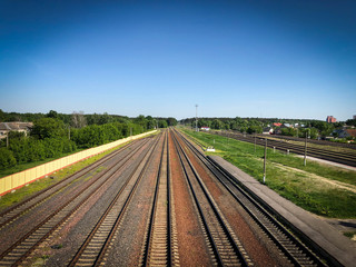 View of the railway going away and the blue sky.