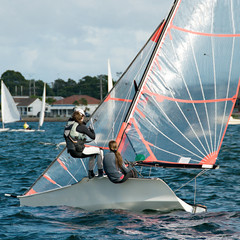 Children Sailing small boats and dinghies on salt water.