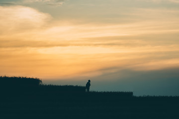Silhouettes of tourist on mountain and rice field. Loney man concept