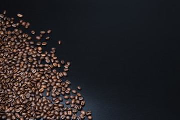 coffee beans on black background with right copy space