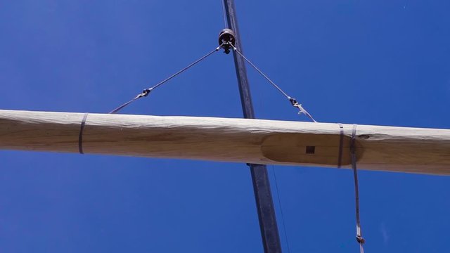 Crane lifts the log. Clip. Crane lifts timber for the construction of a wooden house