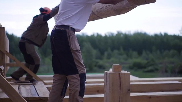 Installation of bar joists for building houses. Clip. Elements of timber construction materials