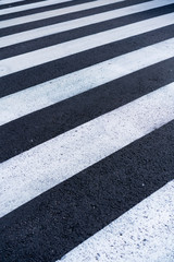 Fototapeta na wymiar White and black asphalt at a street crossing