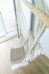 Fototapeta na wymiar White hammock in a room