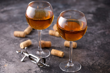 Two glasses with white wine on a textural background. Copy space. Place for your text.