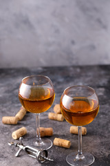 Two glasses with white wine on a textural background. Copy space. Place for your text.