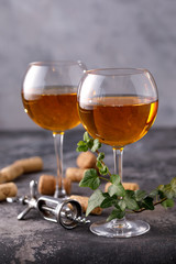 Two glasses with white wine on a textural background. Copy space. Place for your text.