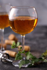 Two glasses with white wine on a textural background. Copy space. Place for your text.