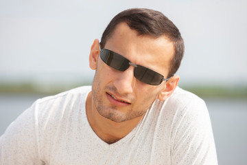 Portrait Of Young Handsome Man Smiling Outdoor