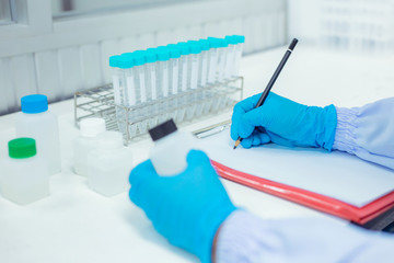 Scientists are sampling the chemical use. The process of research and development in laboratory...