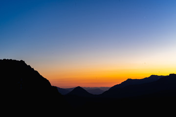 Mount Rainier National Park - Bright colored sunset through the mountains