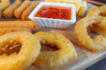 Snack to beer. Squid and cheese in pastry with spicy sauce.