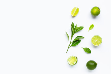 Limes with leaves isolated on white background.
