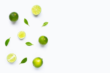 Limes with leaves isolated on white background.