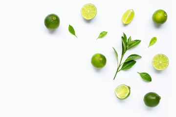 Limes with leaves isolated on white background.