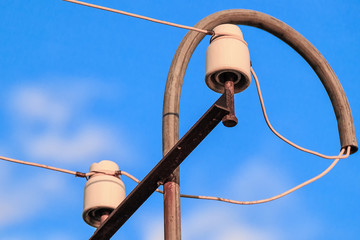 old electric pillar with glass insulators and wires