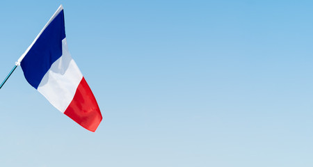 Flag of France waving in the wind in the sky