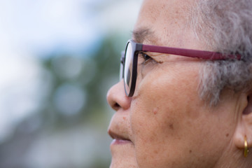Side view of face senior woman wearing glasses
