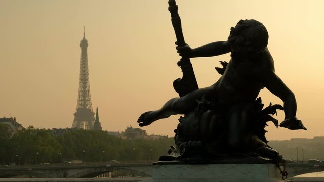  Alexandre III bridge and Eiffel Tower in background in Paris at sunset