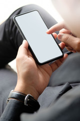 Man relaxing and using smart phone. Top view