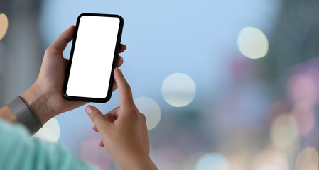 Young man with blank screen smartphone