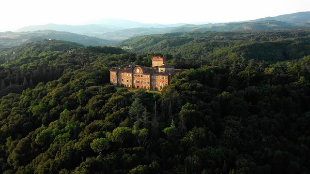 Aerial view of fascinating ancient European castle Castello di Sammezzano of Tuscany featuring Moorish Revival architectural building on a sunny warm summer day. Concept of unique objects in europe
