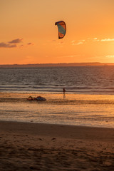 Sunset and Kitesurfers on the beach in Saint Malo,  Brittany, France