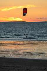  Sunset and Kitesurfers on the beach in Saint Malo,  Brittany, France