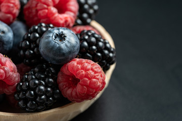 Macro view of mix with ripe blueberry, blackberry and raspberry fruits