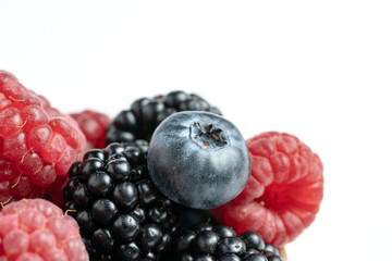 Macro view of mix with ripe blueberry, blackberry and raspberry fruits