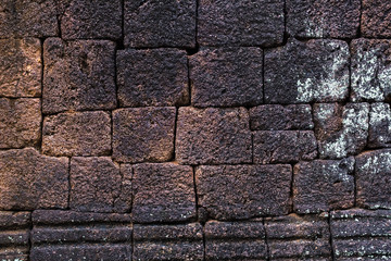 Old laterite brick wall for background.