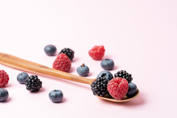 Macro view of different mix with ripe fruits in spoon