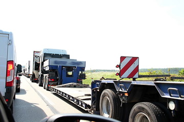 lorries on a freeway parked up outside a company's car parking area ready to deliver goods to customers no people stock photo